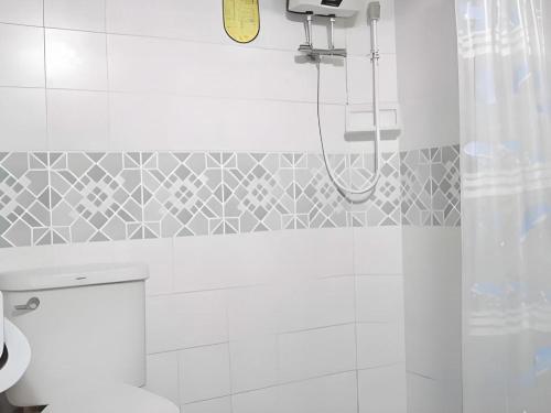 a bathroom with a shower and a toilet at Phucome Resort in Campson