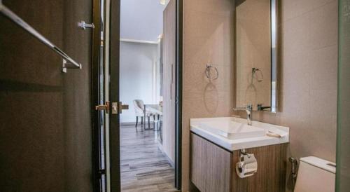 a bathroom with a sink and a mirror at Mossview Resort in Khao Kho