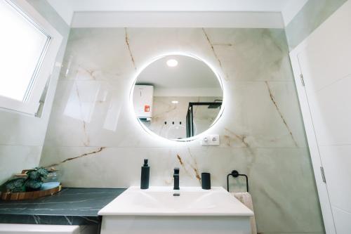 a bathroom with a sink and a mirror at Luxoria in Livno