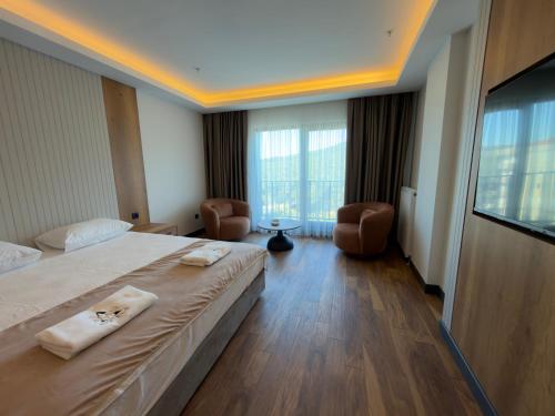 a hotel room with a large bed and a television at Alabi Hotels in Istanbul