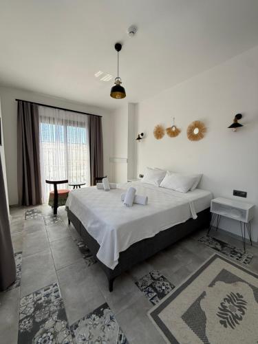 a bedroom with a large bed in a room at La Chance Alaçatı in Alaçatı