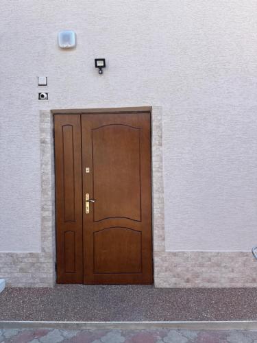 a wooden door in the side of a building at Приватні апартаменти in Odesa