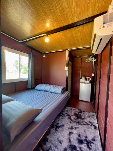 a bedroom with a bed in a room at Lamai Home Koh Yao Noi in Ko Yao Noi