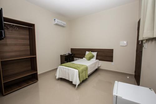 Ένα ή περισσότερα κρεβάτια σε δωμάτιο στο Recanto Hotel Clube