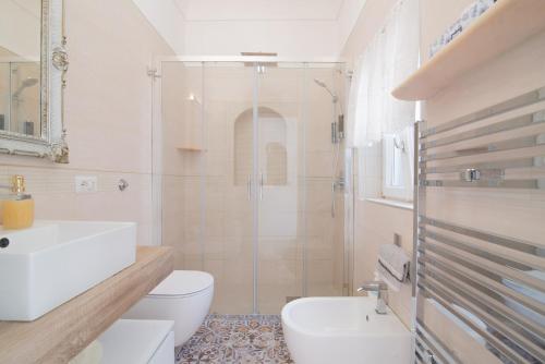 a bathroom with a shower and a toilet and a sink at MARVELOUS CAPRI - Sea View Villa in Capri