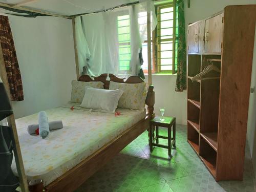 a bedroom with a bed in a room at Jambiani Holiday House in Jambiani