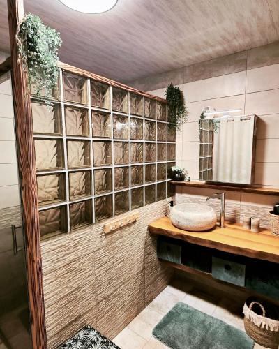 a bathroom with a sink and a mirror at Au Barthas in Caylus