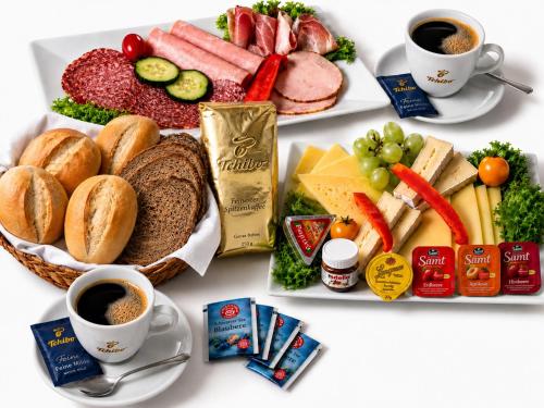 a plate of food with different types of breakfast foods at FeWo Münch Braunlage I Verwaltung und Betreuung durch FIRMA ZZ-Braunlage in Braunlage