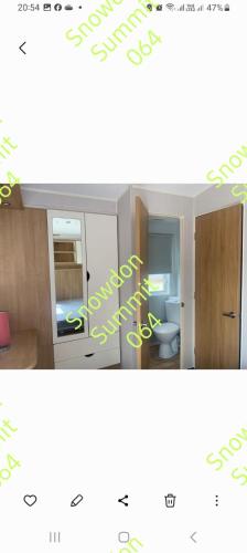a picture of a bathroom with a toilet in a room at Snowdon summit 064 in Barmouth