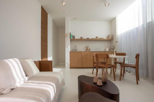 a living room with a couch and a table at NIEL71 Suite in Kerniel