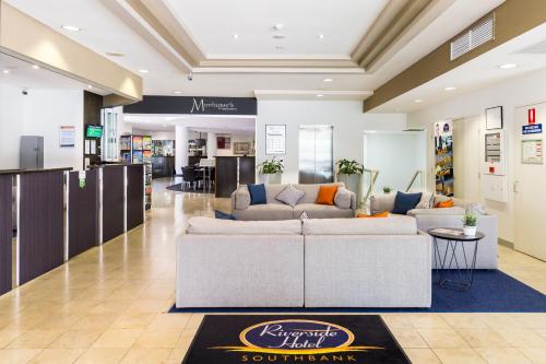 a lobby with a couch in a store at Riverside Hotel Southbank in Brisbane
