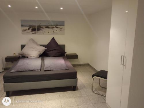 a bedroom with a bed with pillows on it at Ferienwohnung Fuchsbau in Werne an der Lippe