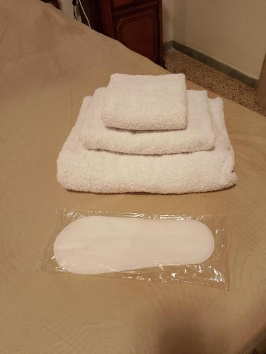 two towels sitting on top of a table at Casa Anna in Ladispoli