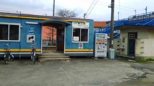 a bus stop with a bike parked in front of it at Hotel Liberty Matsuyama (Adult Only) in Matsuyama
