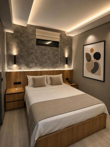 a bedroom with a large bed in a room at Otel OrtaDoğu in Urfa