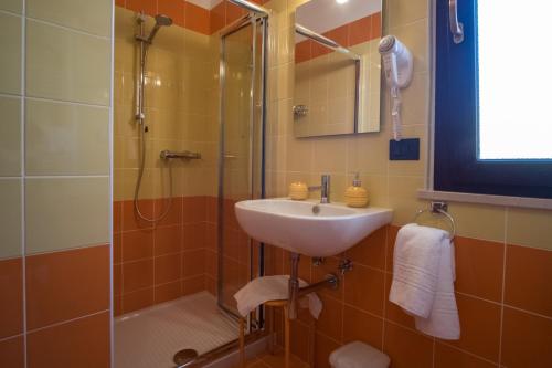 a bathroom with a sink and a shower at Geo House in Termoli