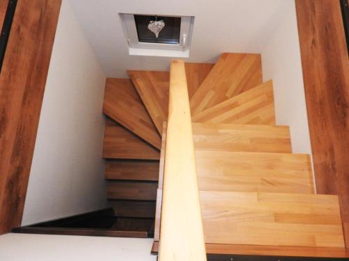 a staircase in a house with wooden floors at Dovolenkový Dom Tatry in Vysoké Tatry