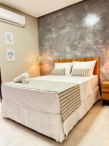a bedroom with a large bed in a room at Pousada Mares Maragogi in Maragogi