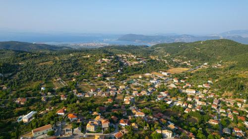 an aerial view of a small town in the mountains at Dervisia Stonehouse 2 in Lazaráta