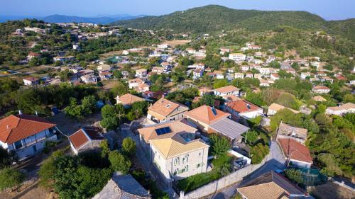 an aerial view of a small town with houses at Dervisia Stonehouse 2 in Lazaráta
