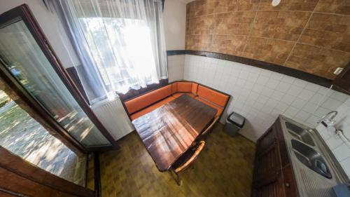 an overhead view of a wooden table in a bathroom at Gorska Vila Sisevac in Sisevac