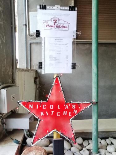 a red star with a sign on top of rocks at Suite 7 &Home Restaurant in Paglieta