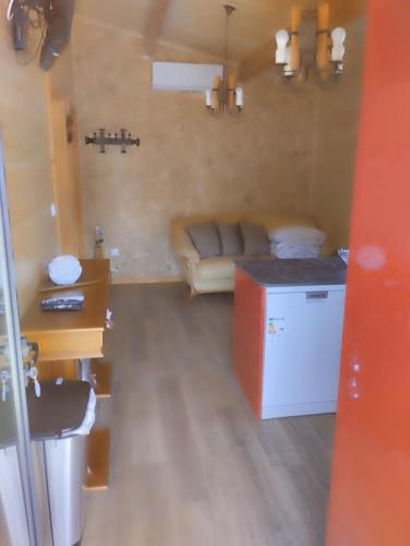 a living room with a couch and a table at Casa dos Cortinhais 2 in Oliveira de Frades