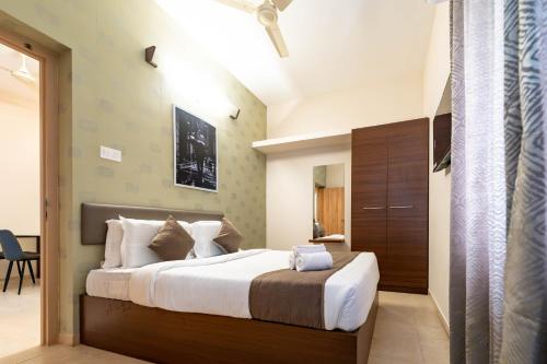 a bedroom with a large bed in a room at viyan stays in Coimbatore