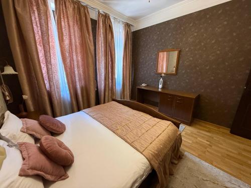 a hotel room with two beds and a window at LUX Apartmani Dubrava in Ivanjica