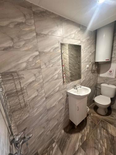 a bathroom with a sink and a toilet at Irene in Pawlikeni
