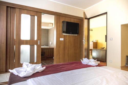 Postel nebo postele na pokoji v ubytování Caramell Premium Resort Superior