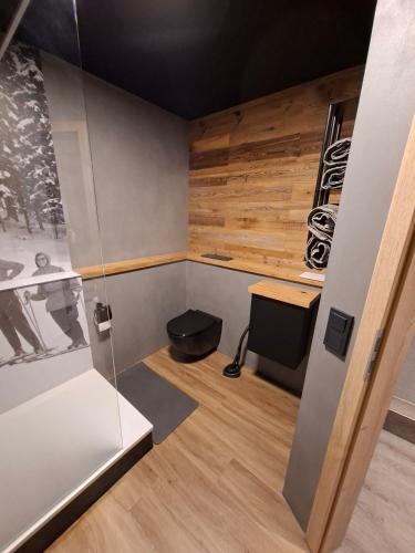 a room with a desk and a glass wall at Chalet-Sonnengarten in Hinterzarten