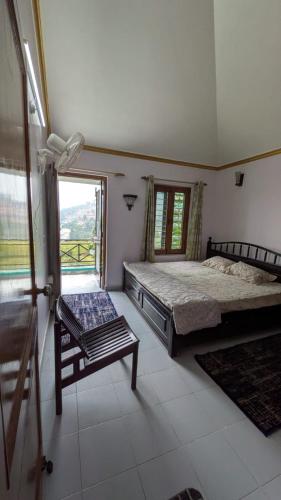 a bedroom with two beds and a window at Kumaon Breeze homestay in Bhowāli