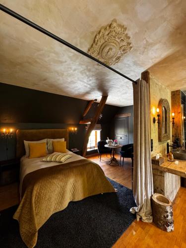 a bedroom with a large bed in a room at La lande sèche in Lainsecq