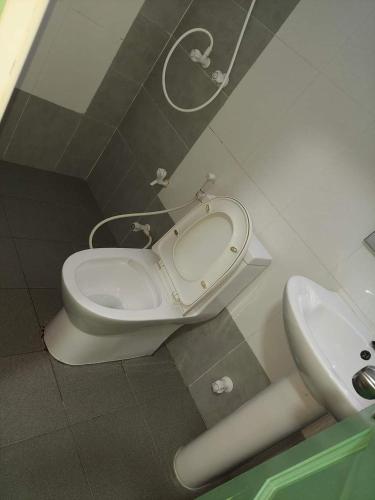 a bathroom with a toilet and a sink at MSM DIAMOND guesthouse 1 in Male City