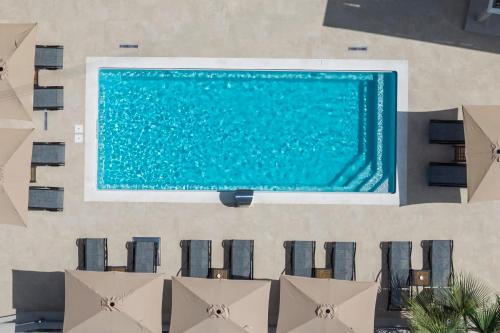an overhead view of a swimming pool in a resort at Amara Cove Adults Only by Estia in Malia