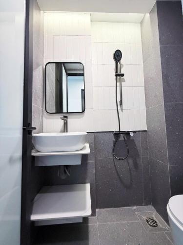 a bathroom with a sink and a mirror at Gang Thep Hotel in Thái Nguyên