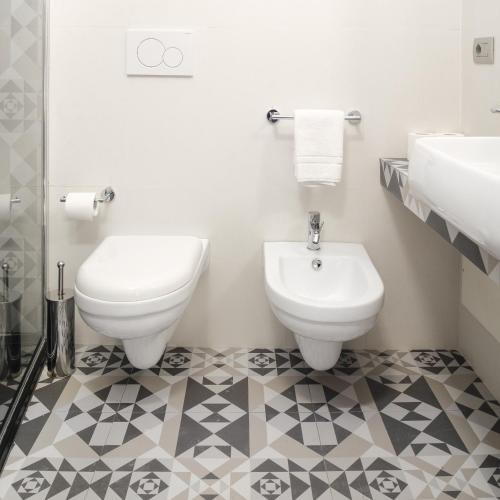 a bathroom with a toilet and a bidet at Sui Tetti Luxury Rooms in Lecce