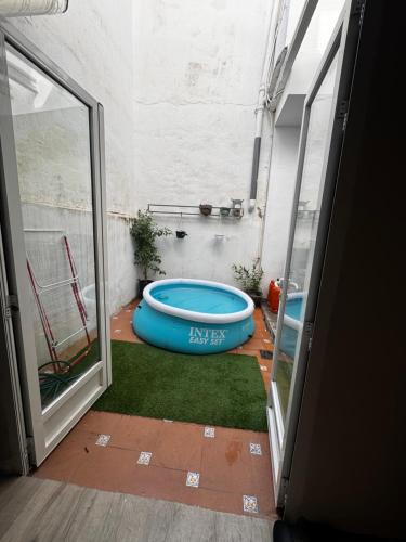 a room with a tub in the middle of a room at Casa Capereta in Alberique