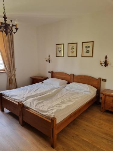 a bedroom with a large bed in a room at Glicine in Carlazzo