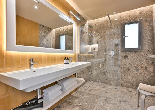 a bathroom with a sink and a shower at Hotel Liliana Diano Marina in Diano Marina