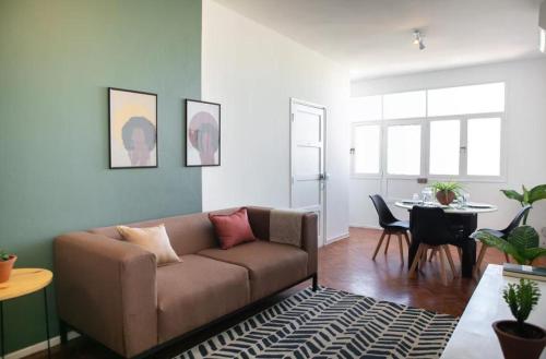 a living room with a couch and a table at Apartamento T3 Belém in Maputo