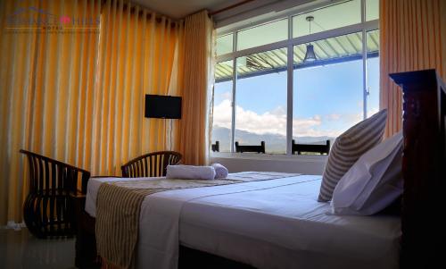 Cama o camas de una habitación en Romance Hills Hotel