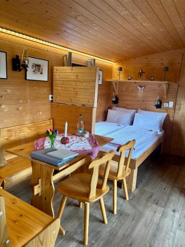 a room with a bed and a table and chairs at Chalet Josef in Braunsbedra