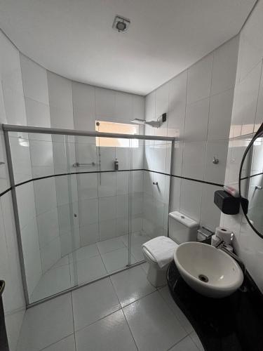 a bathroom with a shower and a toilet and a sink at Fully equipped house - 7 guests in Petrolina