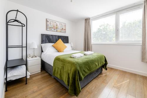 a bedroom with a bed and a large window at Central 1BR Flat Full Kitchen & Washing Machine in Andover