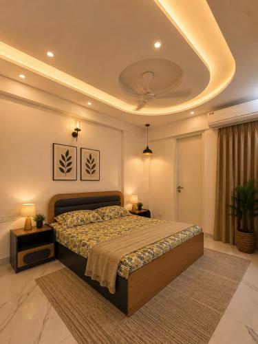 a bedroom with a bed and a ceiling at Gurgaon Legacy in Gurgaon