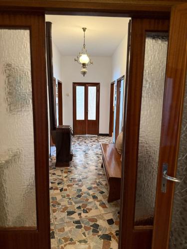 a hallway with a door leading to a living room at Sosta FONTE DAVIDDI in Santa Fiora