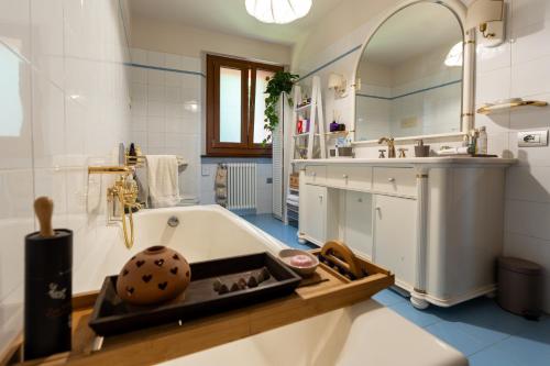 a bathroom with a tub and a sink at I Monelli in Sestola