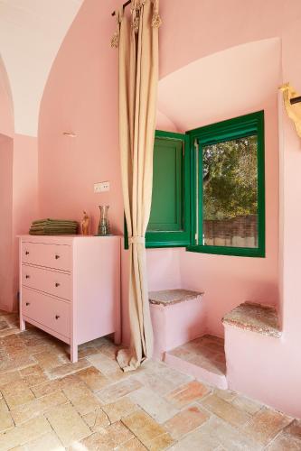 a room with a window and a dresser at Mas Ferrer by 123ole in Sant Andreu del Terri